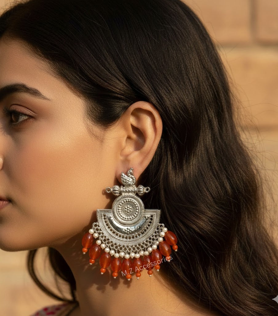 Antique silver swan earrings with orange stone hangings