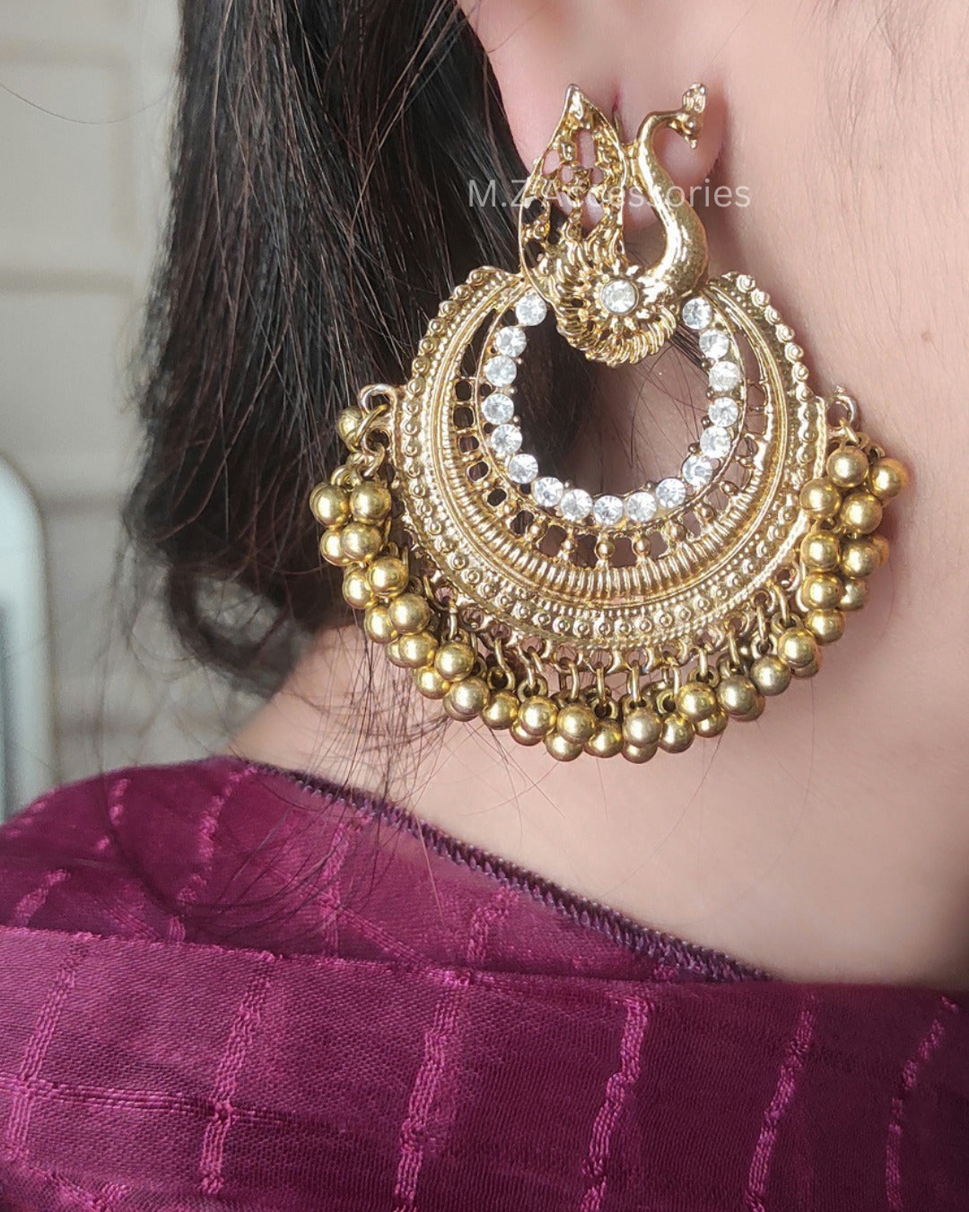 Antique gold polish peacock earrings