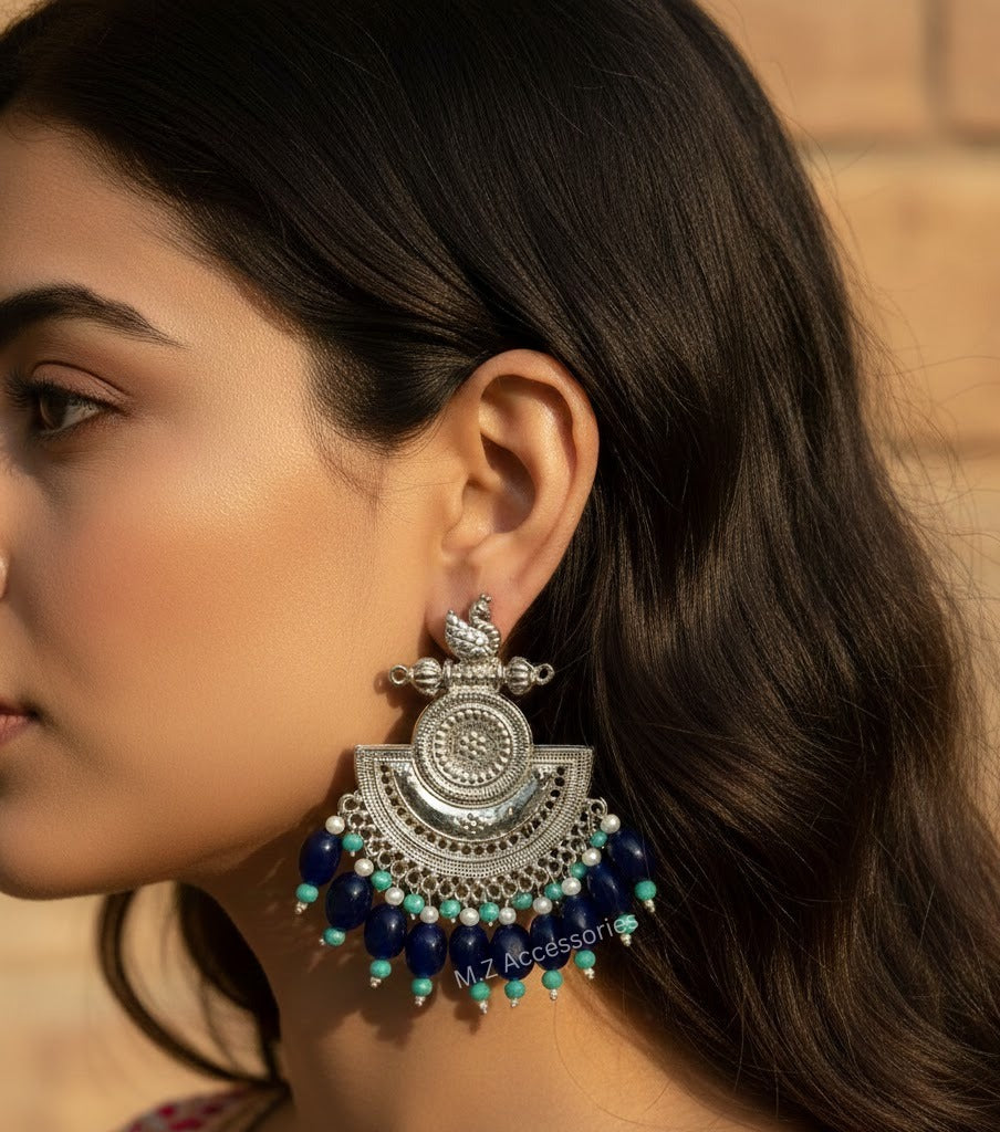 Oxidised silver swan earrings with blue stones