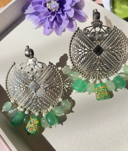 Oxidized pendant earrings with mint color hangings