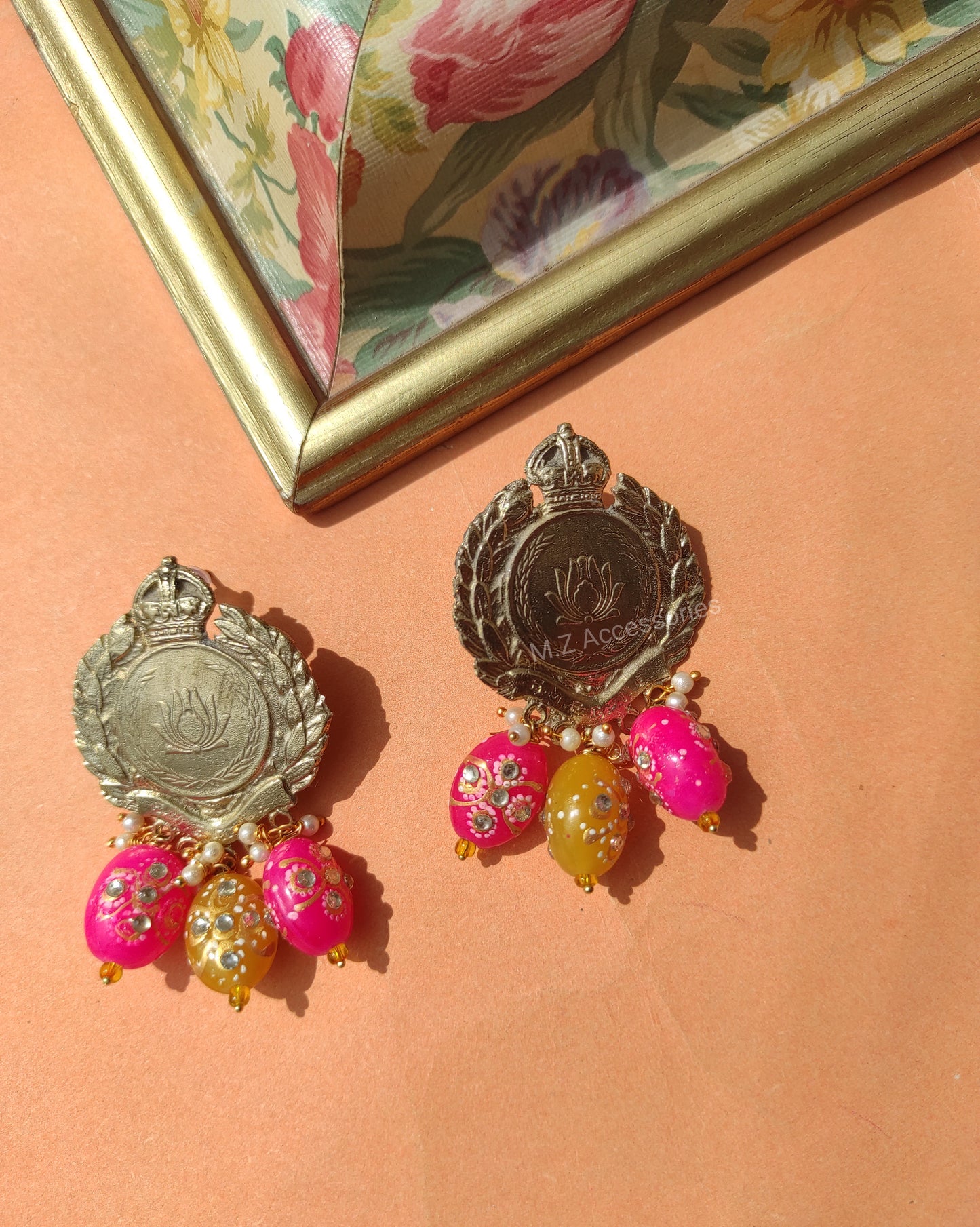 Antique gold polish lotus coin with pink and yellow tumble beads hanging