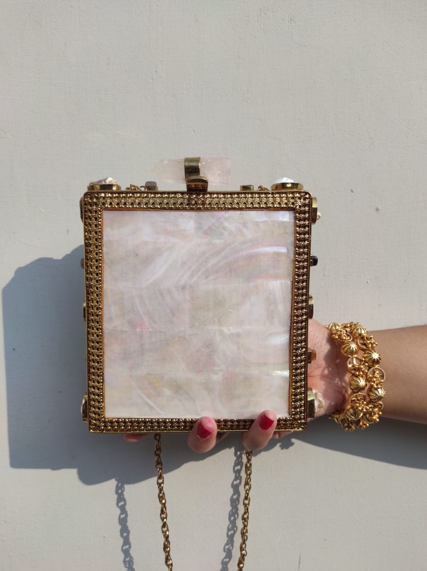 Dual sided mother of pearl clutch